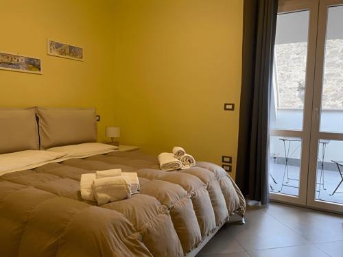 Säng eller sängar i ett rum på Attico Palazzo San Matteo
