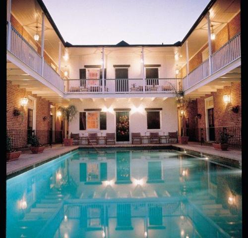 a large swimming pool in the middle of a building at Hotel Provincial in New Orleans