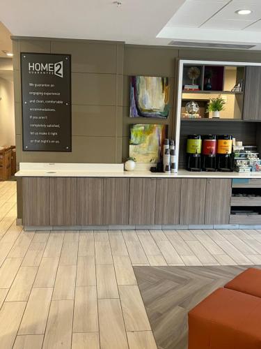 a restaurant with a counter in a store at Home 2 Suites Colonnade Birmingham in Birmingham
