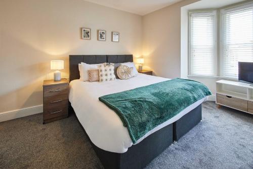 a bedroom with a large bed and a television at Host & Stay - Appleton House in Newark-on-Trent