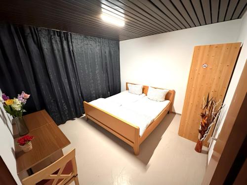 Säng eller sängar i ett rum på F-F Haus