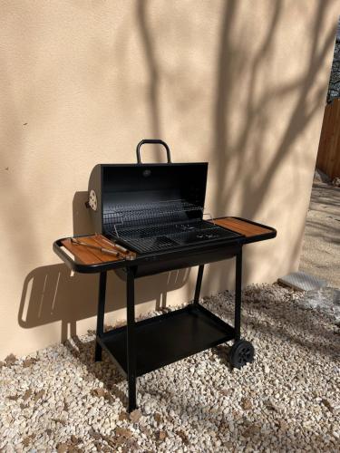 a table with a laptop computer on top of it at Côté nature in Chauzon