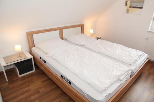 Postel nebo postele na pokoji v ubytování Sommerbrise