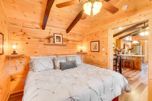 a bedroom with a large bed in a log cabin at Waterfront Seneca Cabin about 4 Mi to Boat Launch! in Walhalla