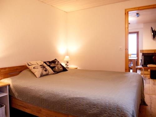 a bedroom with a bed with a pillow on it at Apartment Chavonnes 11 by Interhome in Gryon