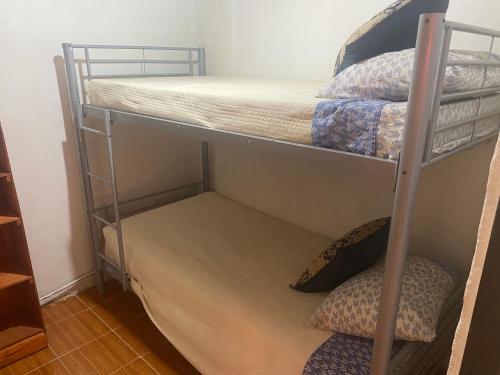 a couple of bunk beds in a room at Quyllur Ancestral in San Pedro de Atacama