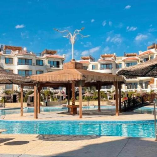 a resort with a swimming pool with a pavilion at Sharm Hills Resort in Sharm El Sheikh