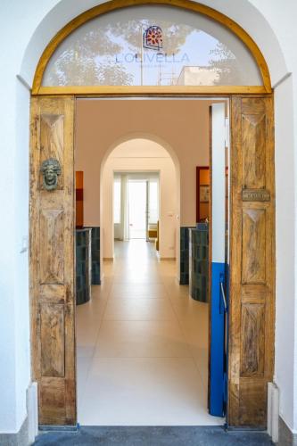 an open door into a room with a hallway at Dimora Maiuri L'Olivella in Anacapri