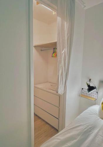 a white bedroom with a bed and a closet at 20% Monthly stays - 3 bedrooms @ Homevy Leeds in Beeston Hill