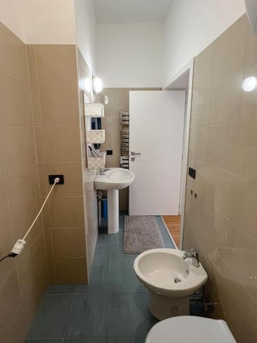 a bathroom with a toilet and a sink at Casa vacanze Omero in San Salvo