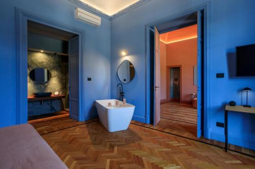 TV a/nebo společenská místnost v ubytování Belmonte Luxury Rooms - LR Collection