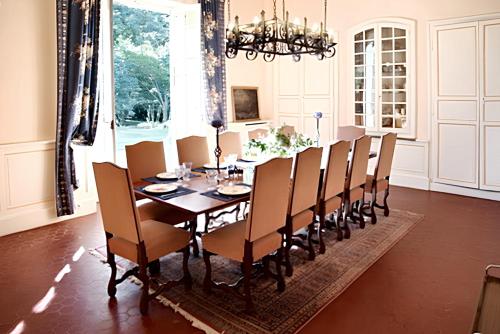 a dining room with a table and chairs at Villa de 10 chambres avec vue sur la ville piscine privee et jardin amenage a Villeneuve sur Lot in Villeneuve-sur-Lot