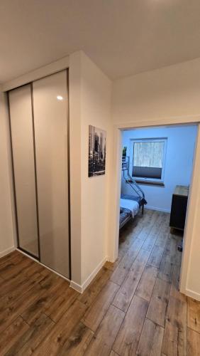 Una cama o camas en una habitación de Apartament Gdańsk Sobieszewo