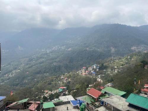 a view of a city with a mountain at Entire flat to enjoy Gangtok in Gangtok