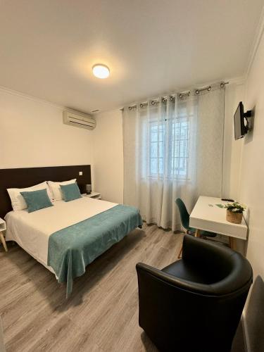 Ένα ή περισσότερα κρεβάτια σε δωμάτιο στο Casa do Paço