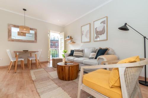 a living room with a couch and a table at Casa da Avenida 2 - Centro - Terraço Privado in Tavira