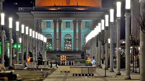 a large building with a bunch of lights in front at Affordable apartment close to the castle in Hunedoara