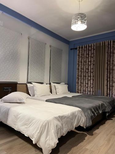 Postel nebo postele na pokoji v ubytování Dream's Hotel
