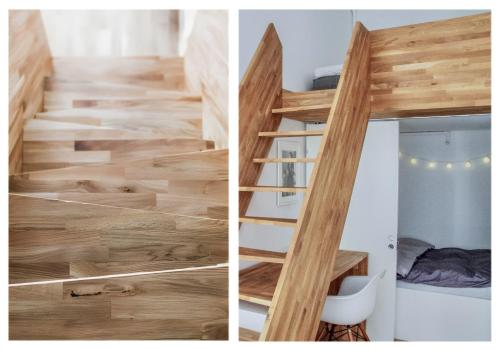 una escalera con bordes de madera en una habitación pequeña en Modern and centrally located 2-Bedroom apartment en Bergen