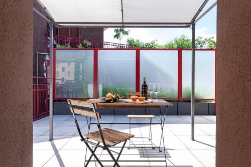 a table and a chair on a patio at art of design & terrace in Milan