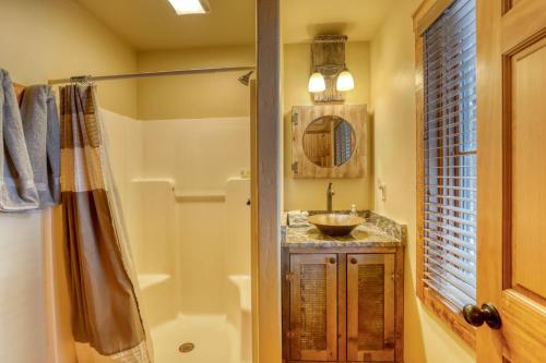 a bathroom with a sink and a shower at Silver King Lodge in Deadwood