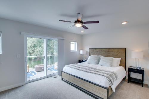 a bedroom with a bed and a ceiling fan at Riverfront Sheboygan Townhome with Grill! in Sheboygan