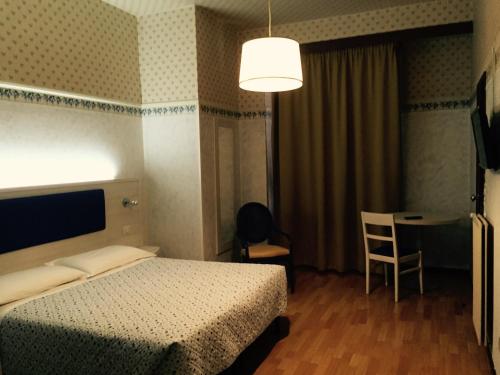 Postel nebo postele na pokoji v ubytování Hotel Biondi