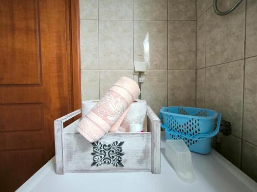 a bathroom with a basket of towels on a tub at Simos Summer House in Fanari in Fanárion