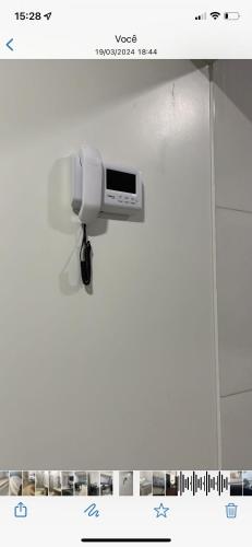 a security camera on the wall of a bathroom at Casa Rio verde in Rio Verde