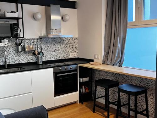 Η κουζίνα ή μικρή κουζίνα στο SG Apartamentos, Silió 4B AT 47-79