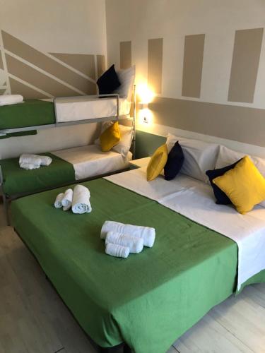 Postel nebo postele na pokoji v ubytování Hotel Napoleon
