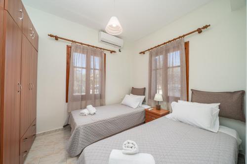 מיטה או מיטות בחדר ב-Sea Salt Apartments