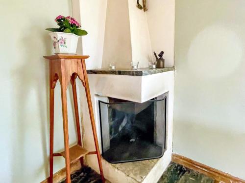 a living room with a fireplace and a sink at Holiday home ONSALA VI in Onsala