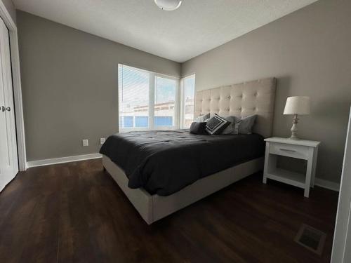 a bedroom with a large bed and a window at Luxury Downtown Townhome Unit 7 in Cleveland