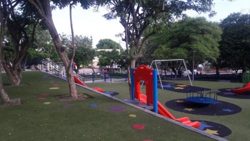 a park with a playground with a slide and swings at VIVIENDA TURISTICA ROYAL INN in Barranquilla