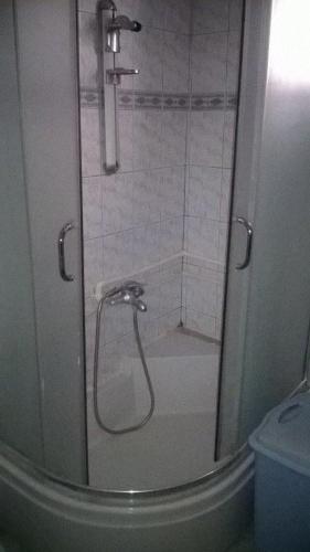 a shower with a glass door in a bathroom at Guest House Ohrid Trpeski in Ohrid