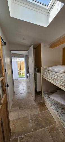 a room with two bunk beds and a hallway at Chez Lisa in Saint-Louis-du-Rhône