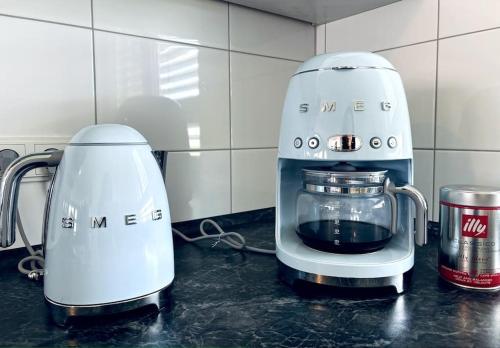 two blenders sitting on a counter in a kitchen at Lakefront View Entire Apartment with 2 bedrooms, 2 full bathrooms & Balcony Waterview in Reichenau