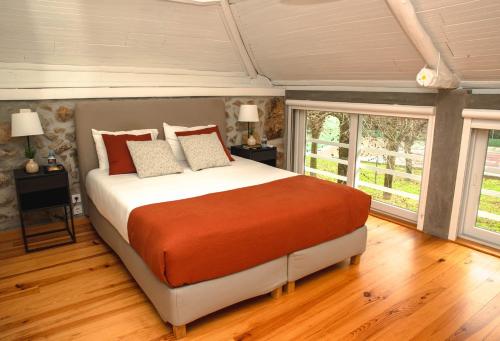 Ένα ή περισσότερα κρεβάτια σε δωμάτιο στο Casas do Souto