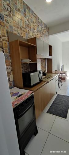 Een keuken of kitchenette bij Residencial da Coruja