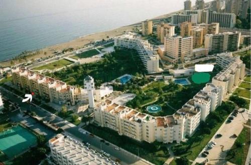 an aerial view of a city with buildings and the ocean at Luxury apartments Alamos beach Torremolinos - Costa Lago in Torremolinos