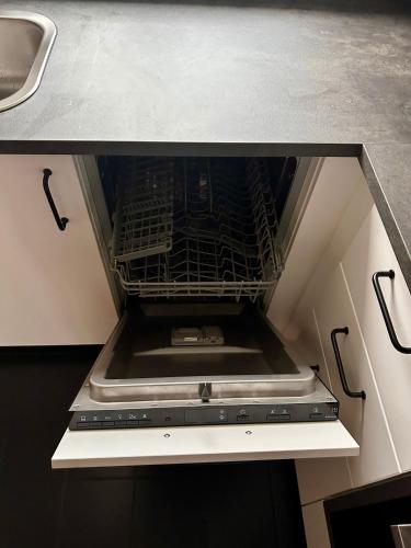 a stove top oven sitting in a kitchen at Sonnen Apartment in Bad Aibling