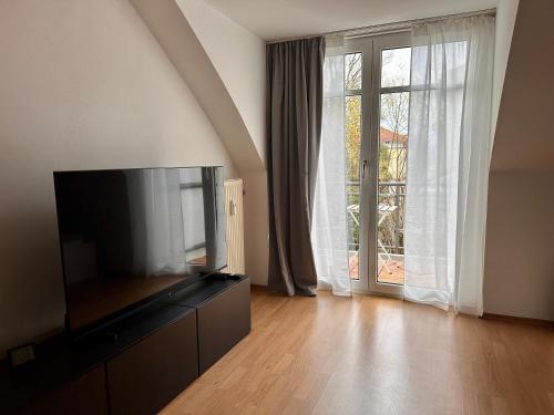 TV a/nebo společenská místnost v ubytování Sonnen Apartment