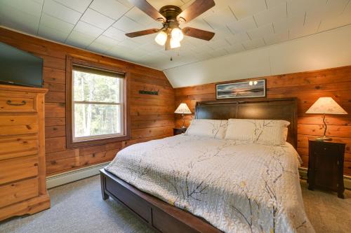 a bedroom with a bed and a ceiling fan at Bright Home with Outdoor Space, Steps to River in Indian River