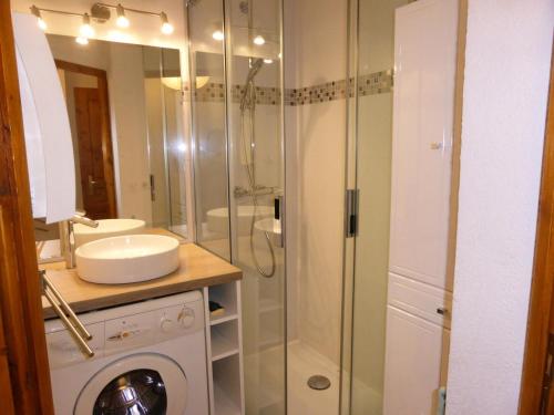 a bathroom with a sink and a glass shower at Résidence Palmes D'or - 2 Pièces pour 4 Personnes 504 in Les Contamines-Montjoie