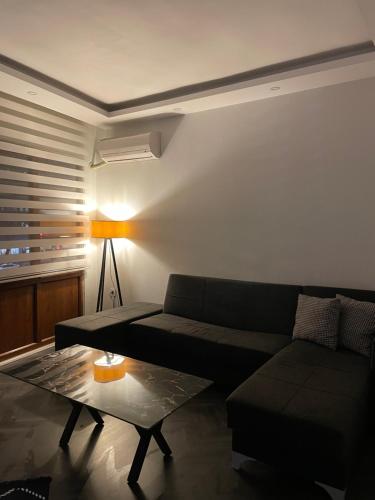 a living room with a couch and a table at Stay in the heart of the city in Istanbul