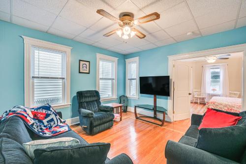 a living room with a couch and chairs and a flat screen tv at 5 Mi to Dtwn Boston! Family-Friendly Medford Apt in Medford
