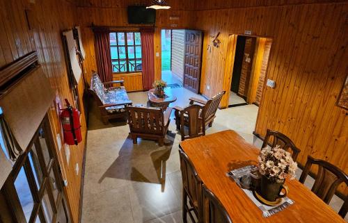 an overhead view of a living room with a table and chairs at La Floresta - Cabañas con Naturaleza y Tranquilidad in Puerto Iguazú