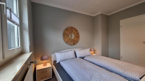 Postel nebo postele na pokoji v ubytování Haus Spökenkieker Loppersum