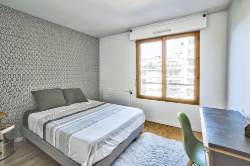 En eller flere senger på et rom på Apartment near la Villette